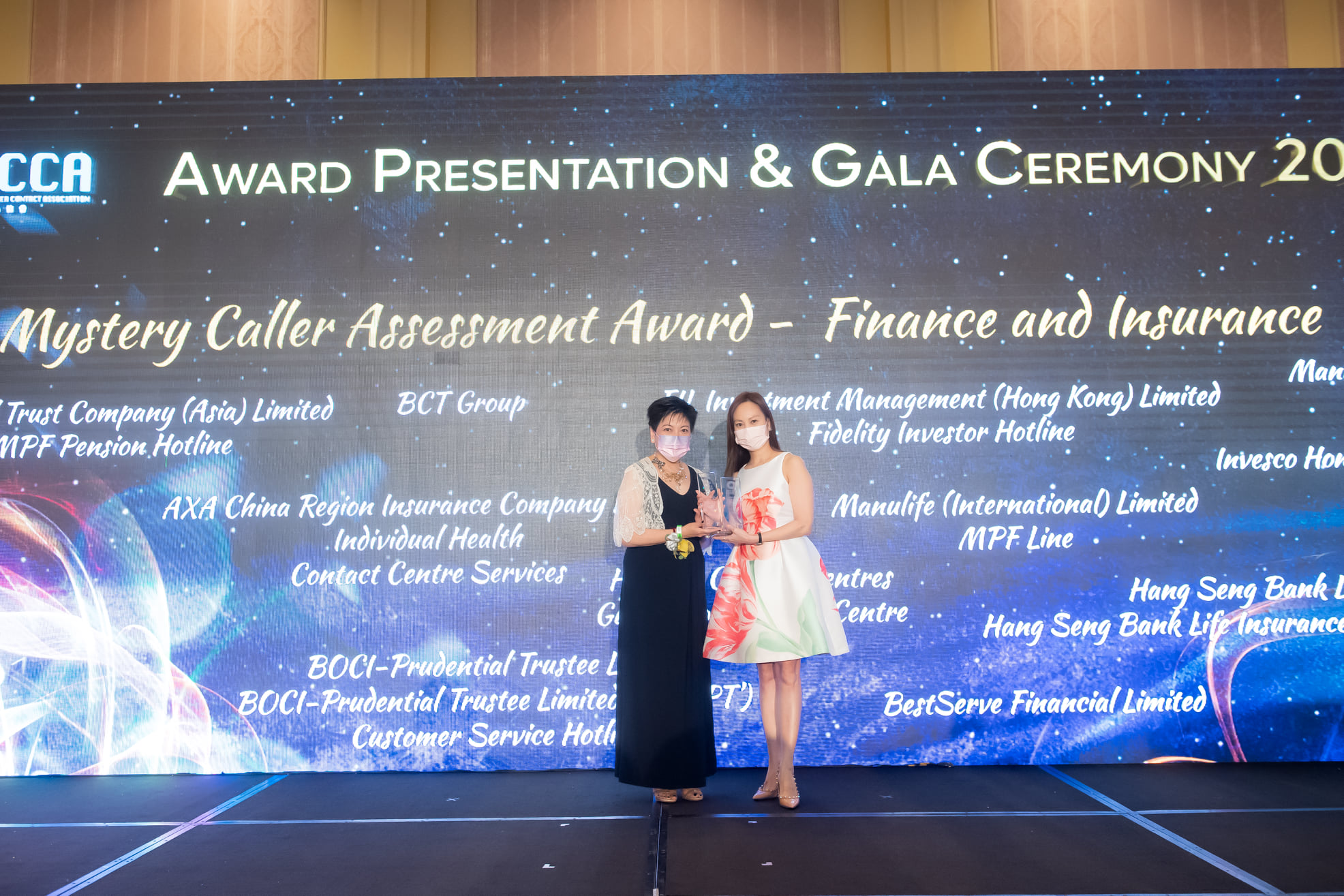 Agnes Tse, Senior Director of Business Development & Strategy of BCT Group (right), received "Best-in-Class" award and "Gold" award in the "Finance and Insurance" sector at the "Mystery Caller Assessment Award” from Vice Chairlady of HKCCA, Ms. Joyce Poon